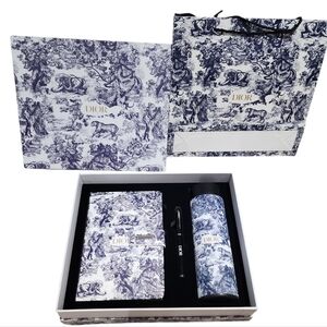 Dior GWP notebook, pen, and thermos with tea infuser and electronic temperature